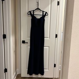 Stunning, formal dress in navy blue tulip style fit never worn.